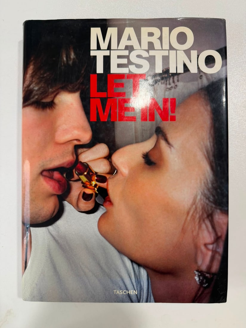 Mario Testino – “Let Me In!” (Taschen, 2012) | Hardcover Photobook Signed by the Artist: Mario Testino (b. 1954)“Let Me In!”Publisher: TASCHEN, Köln (2012)Format: Hardcover with Dust JacketInscriptions: Hand-signed by Mario Testino on the title page in black marker below the offi