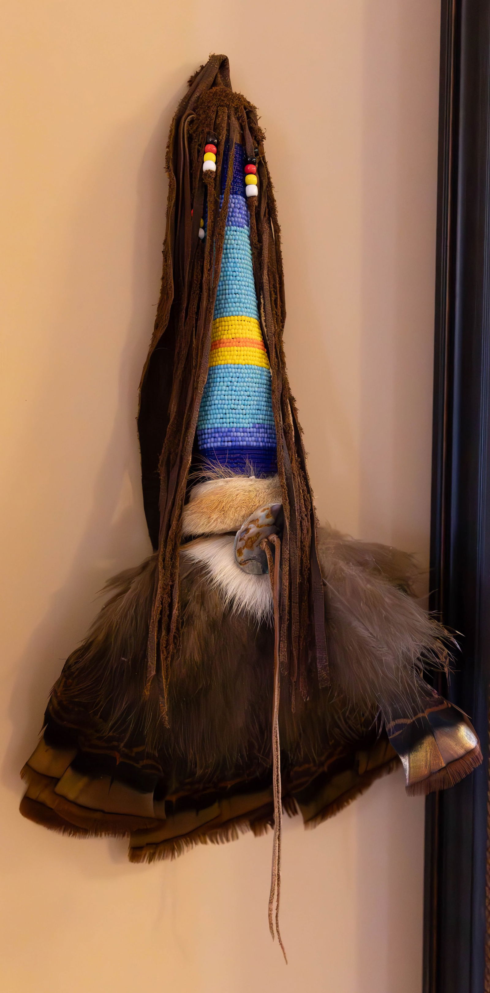 Native American Rattle and Smudge: Native American Rattle and Smudge. Smudge: Feather fan, delicate beadwork with colour variations and leather tassel fringe. Size 17" length. Rattle: This tool uniquely incorporates the element of a sm