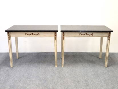 PAIR NEOCLASSICAL STYLE MARBLE TOP SIDE TABLES: Pair of vintage Italian Neoclassical / Louis XVI style cream colored black marble top console side tables with tapered legs and gold tone accents. Each one measures 27.25" tall, top measures 34.75" wi