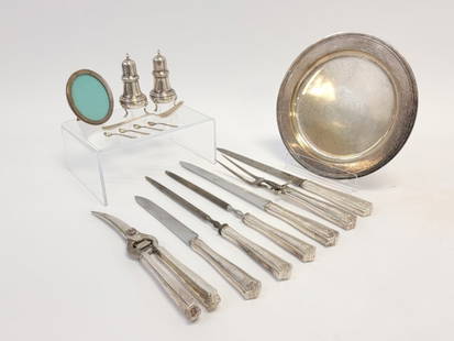 ASSORTED TIFFANY & CO STERLING SILVER TABLEWARES: Lot of assorted Tiffany & Co sterling silver tablewares. Includes (4) 2.125" long salt spoons, a 10" diameter monogrammed plate, a 3.75" tall oval photo frame, a pair of 4.35" tall salt & pepper shake