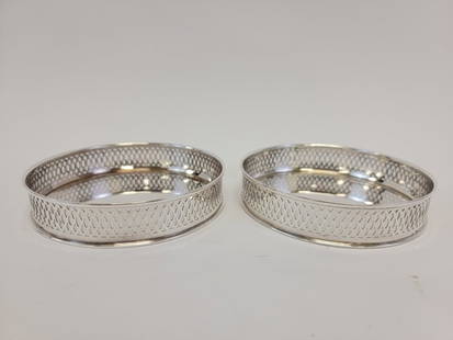 PR ITALIAN .800 SILVER RETICULATED BOTTLE COASTERS: Pair of Italian .800 silver reticulated gallery edge bottle coasters, each measuring 1" tall x 4.9" diameter. Both are hallmarked appropriately. Condition: good but for minor tarnishing and one with t