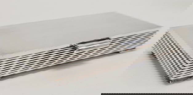 VINTAGE GEORG JENSEN STERLING SILVER CIGARETTE BOX: Vintage Georg Jensen Art Deco style sterling silver footed cigarette box measuring 5.25" wide x 3.4" deep and .875" tall. Designed by Sigvard Bernadotte. Marked on base with illegibly signature follow