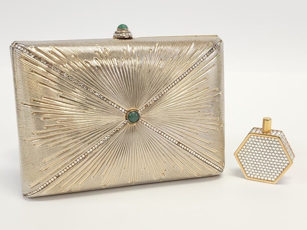 JUDITH LEIBER STARBURST CLUTCH & PERFUME BOTTLE: JUDITH LEIBER STARBURST CLUTCH & PERFUME BOTTLE: Swarovski crystal gold starburst minaudière. Gold tone exterior with clear Swarovski crystals and center jade cabochon in the starburst design on both