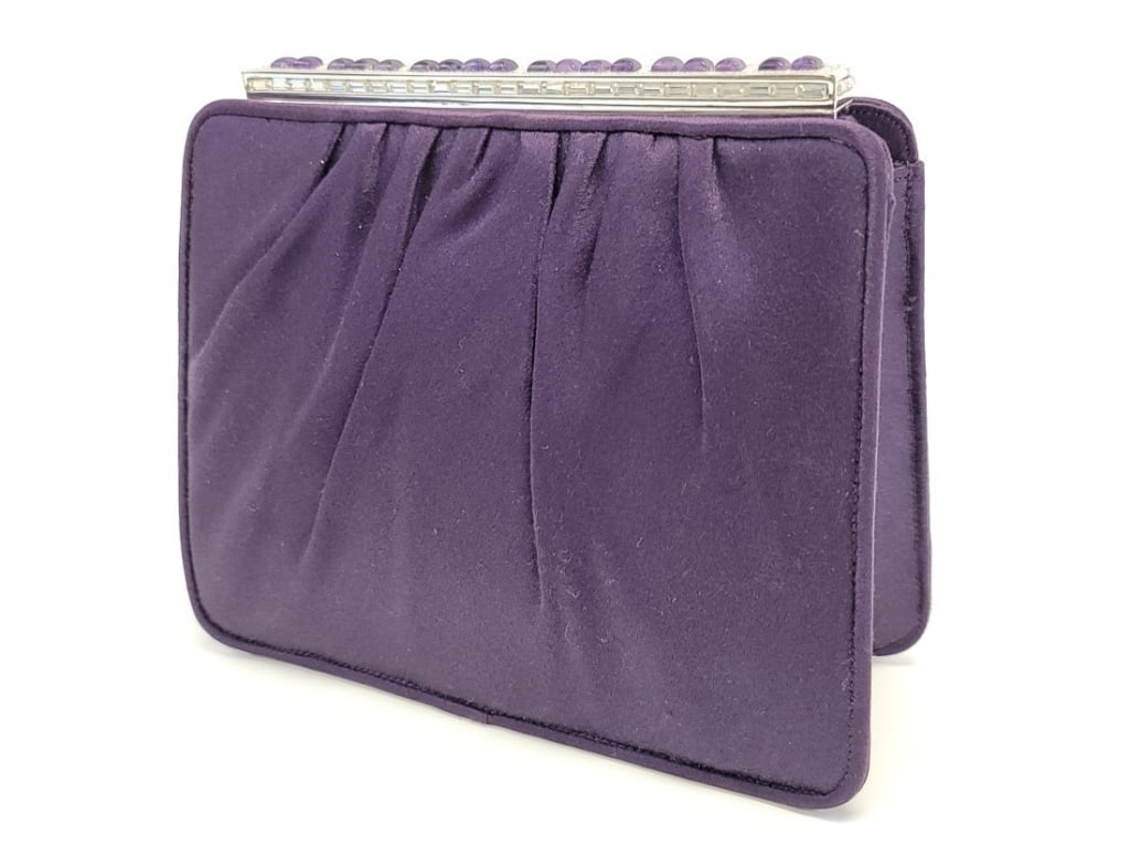 JUDITH LEIBER PURPLE SATIN & AMETHYST CLUTCH: JUDITH LEIBER PURPLE SATIN & AMETHYST CLUTCH: purple satin clutch with silver tone Swarovski crystal and amethyst cabochon top frame. Clutch is lined in purple satin, has two interior pockets and matc