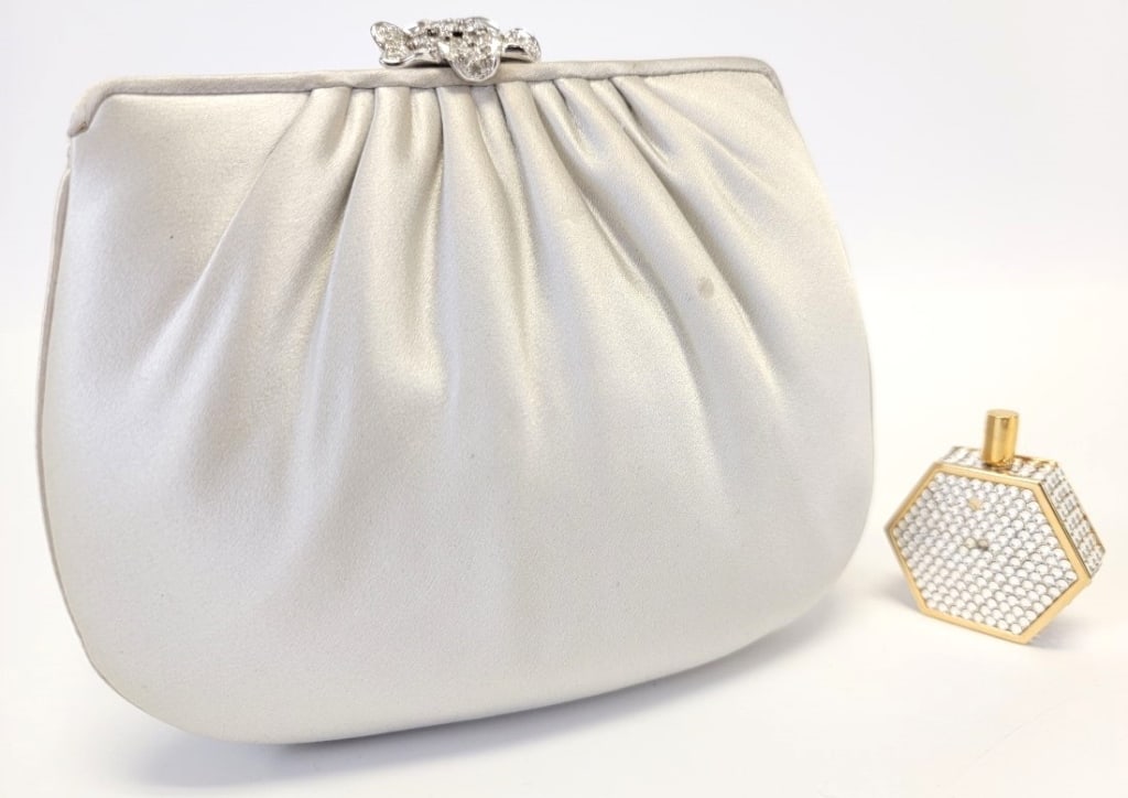 JUDITH LEIBER GREY EVENING CLUTCH & PERFUME BOTTLE: JUDITH LEIBER GREY EVENING CLUTCH & PERFUME BOTTLE: pale grey silk satin evening clutch with silver tone hardware and Swarovski crystal flower clasp. Braided fabric rope strap with tassel, satin lined