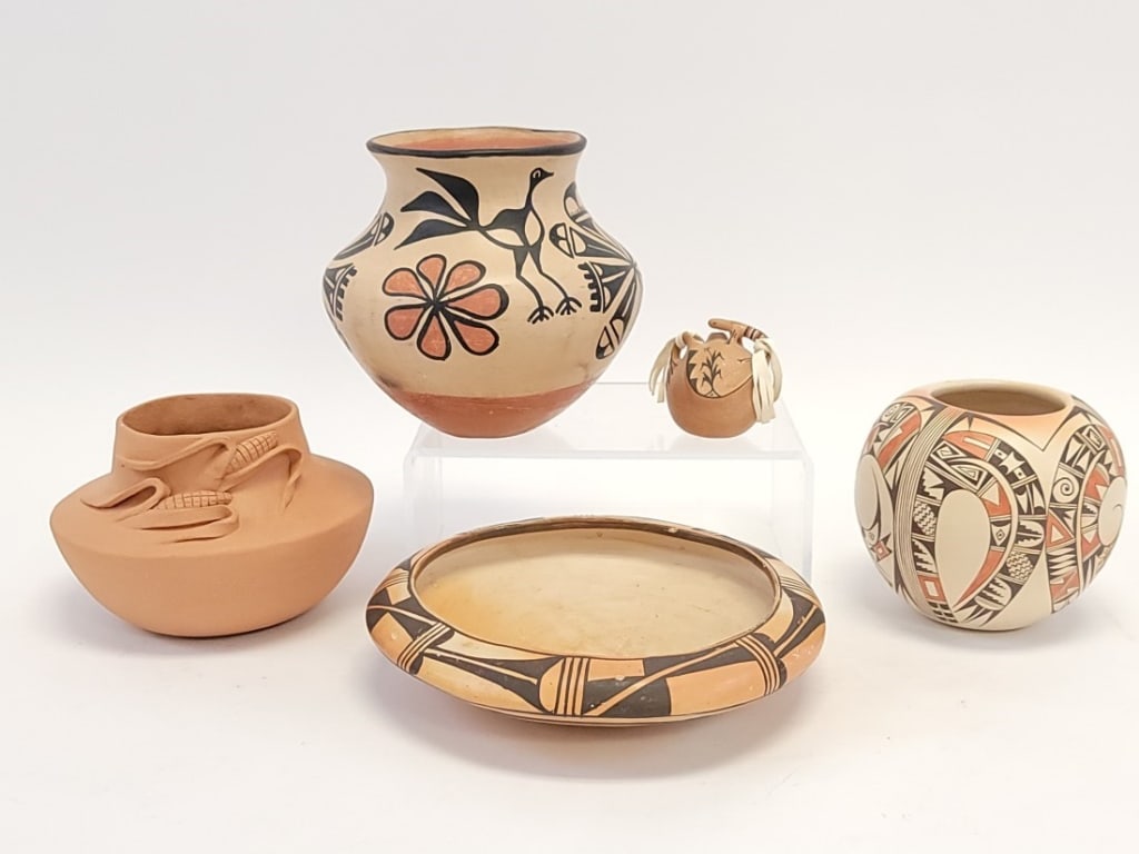 FIVE NATIVE AMERICAN PUEBLO POTTERY VESSELS: Lot of five Native American Pueblo pottery vessels. Includes one signed J. Suazo DuBray, one signed L David, and three unsigned. Largest is the unsigned bird motif pot at 6.5" tall. Condition: the tin