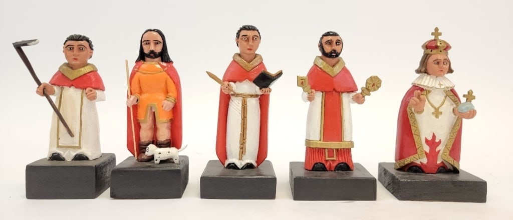 FIVE ROBERTO RIVERA CARVED WOOD SANTOS FIGURES: Lot of five folk art carved and painted wood santos figures by Roberto Rivera, Corozal, Puerto Rico. Includes San Ramon, El Nino de Atocha, San Isidro el Agricultor, San Valentine, and San Roque. Tall