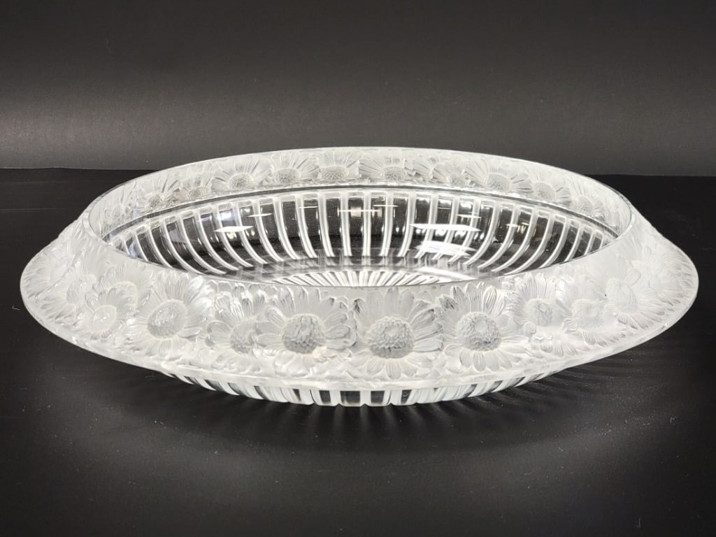 LALIQUE "MARGUERITE" FROSTED CRYSTAL LOW BOWL 13": Lalique "Marguerite" pattern frosted crystal low bowl measuring 13" in diameter. Daisy pattern around the rim, signed on base. Condition: two very small flakes to rim, two small flakes to the relief d