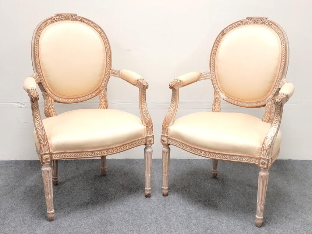 PAIR ANTIQUE 19TH C NEOCLASSICAL STYLE ARMCHAIRS: Pair of antique 19th century Louis XVI / Neoclassical style armchairs with off-white fabric upholstery. Each chair measures 38" tall x 24" wide and 22" deep. Condition: scattered small stains to uphol