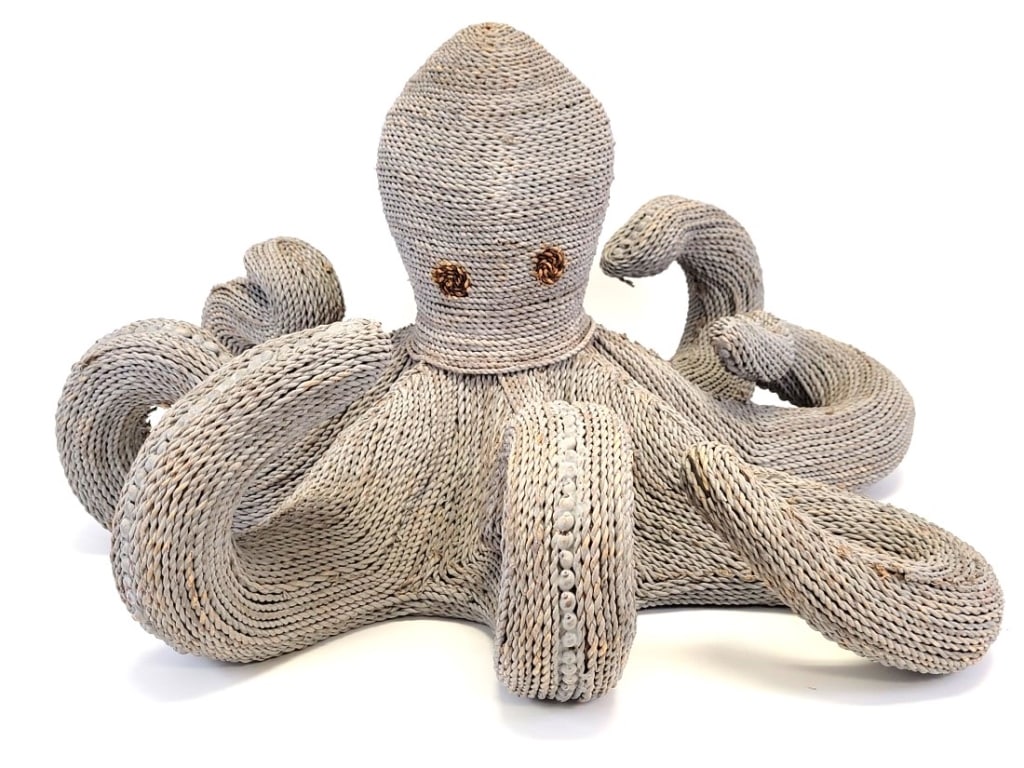 VINTAGE HAND-WOVEN SEAGRASS OCTOPUS SCULPTURE: Vintage mid-century hand-woven seagrass and seashell sculpture of an octopus. Measures a total of 16" tall x approx. 28" wide. Condition: some areas of fraying and small nicks, some of the seagrass en