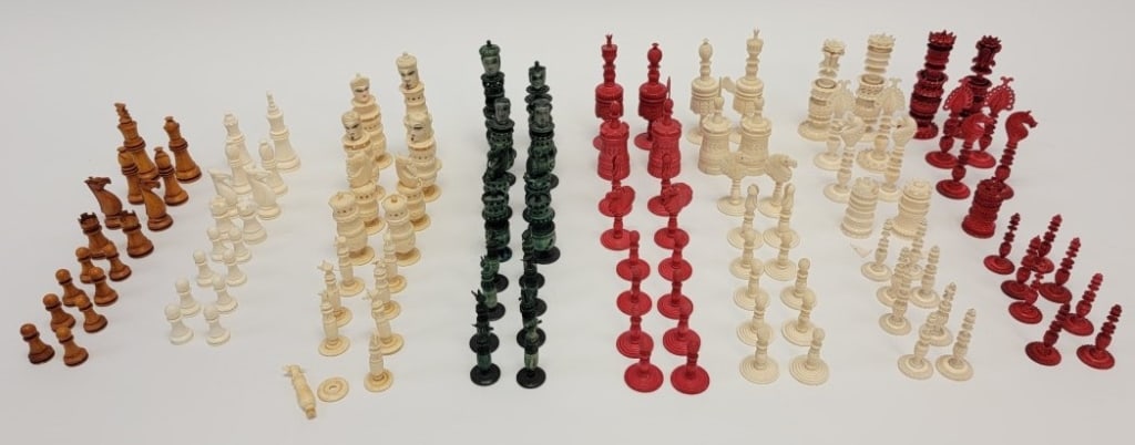 LARGE LOT OF CARVED BONE CHESS PIECES, 4 SETS: Large lot of carved bone chess pieces. Includes a green and white complete but damaged set, a red and white complete set with minor damages, a complete brown and white set, and a finely detailed red a