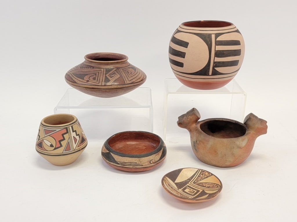 SIX NATIVE AMERICAN PUEBLO POTTERY VESSELS: Lot of six assorted Native American Pueblo pottery vessels. The largest measuring 5.8" tall by Abel and Carol Calabaza, a small shallow bowl by M. Shelley, a bowl with two head form handles by Sara Ay