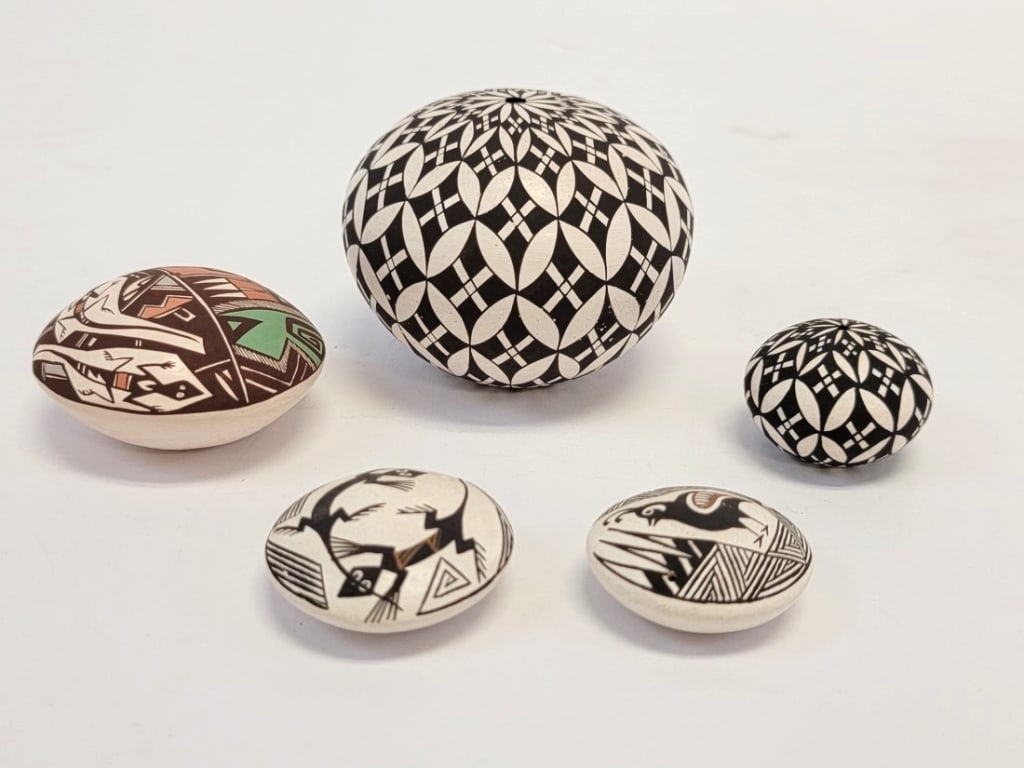 FIVE ACOMA POTTERY MINIATURE SEED POTS, R. CONCHO: Lot of five Acoma pottery miniature seed pots. Includes one by an unknown artist, one by L. Concho, two by L. Concho and two by Rachel Concho. The largest is the black and white Rachel Concho seed pot