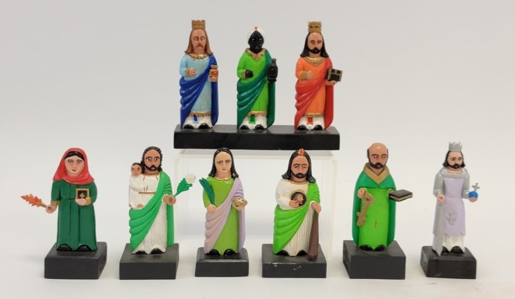 SEVEN ROBERTO RIVERA CARVED WOOD SANTOS FIGURES: Lot of seven folk art carved and painted wood santos figures by Roberto Rivera. Includes Los Tres Santos triple figure, San Pedro, San Judas Tadeo, San Fernando, Santa Lucia, Untitled man with child, 