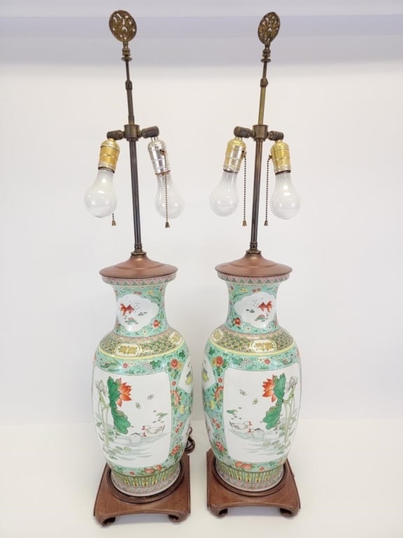 PR CHINESE FAMILLE VERTE PORCELAIN VASE TABLE LAMP: Pair of contemporary Chinese Famille Verte pattern porcelain vases mounted as table lamps. No shades included. Each one measures a total of 37.5" tall to the tip of the finial, 19.25" tall to the top
