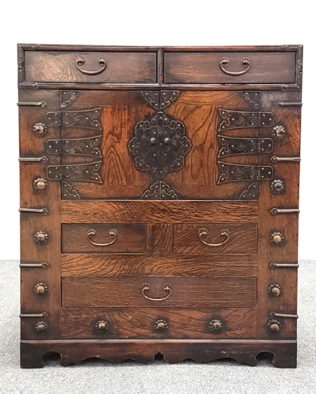 VINTAGE PETITE JAPANESE TANSU STYLE CHEST: Vintage petite Japanese Tansu style chest measuring 23.5" tall x 20.25" wide and 14.5" deep. Decorative metal mounts throughout. Condition: a few small chips to veneer at the lower rear left corner, n