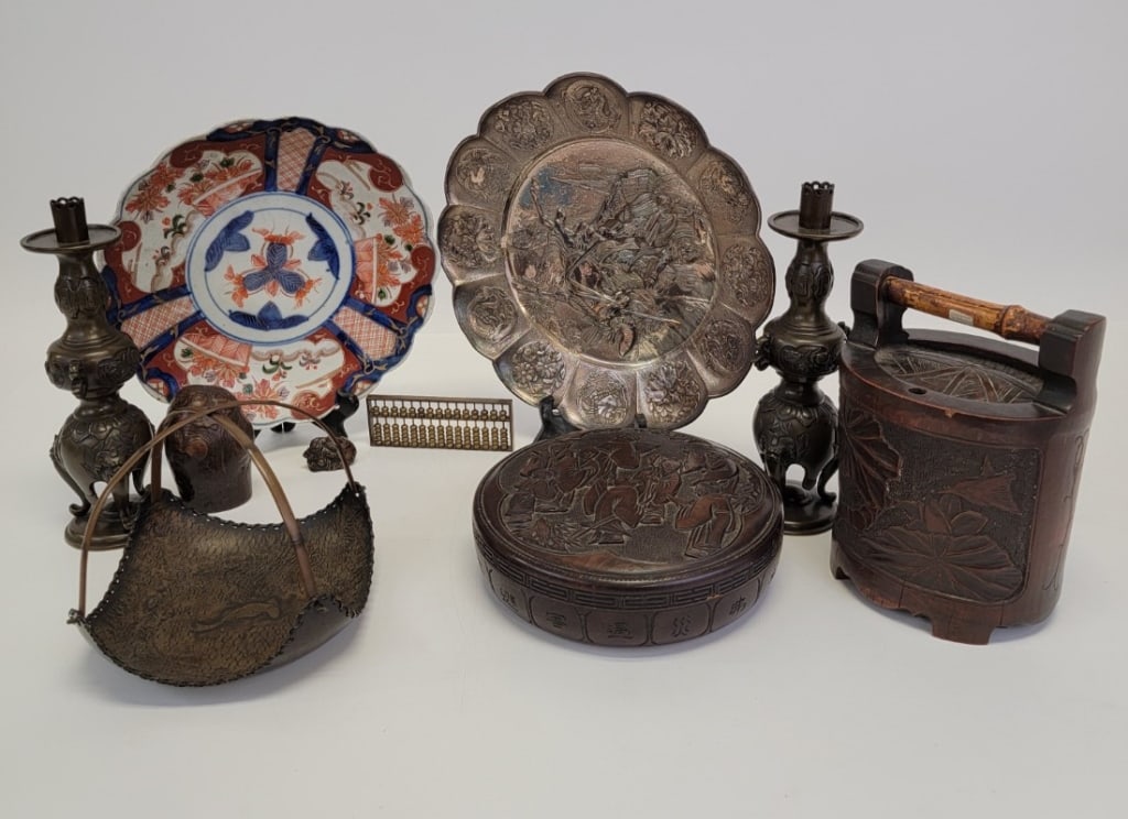 COLLECTION JAPANESE ANTIQUES, BRONZE IMARI ETC 10p: Collection of assorted Japanese antiques. Includes an 11" Imari plate, round carved box, silver plated & mixed metal embossed charger, bronze abacus, a burled wood cup, small metal okimono paperweight