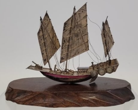ANTIQUE CHINESE SILVER "JUNK" SAILBOAT ON STAND: Antique late 19th / early 20th century Chinese "Junk" sailboat mounted to wooden stand. Extremely intricate handmade details all assembled mostly with pins allowing for articulation of the sails, cann