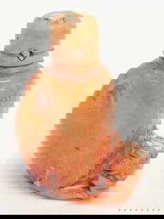 CHINESE FIGURAL CARVED CORAL SNUFF BOTTLE: Chinese figural carved coral snuff bottle depicting a foo dog or temple guardian lion. Retains original stopper with cork and spoon. Measures a total of 3.5" tall x 2.5" wide. Unsigned. Condition is g