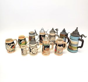 COLLECTION OF ELEVEN GERMAN BEER STEINS