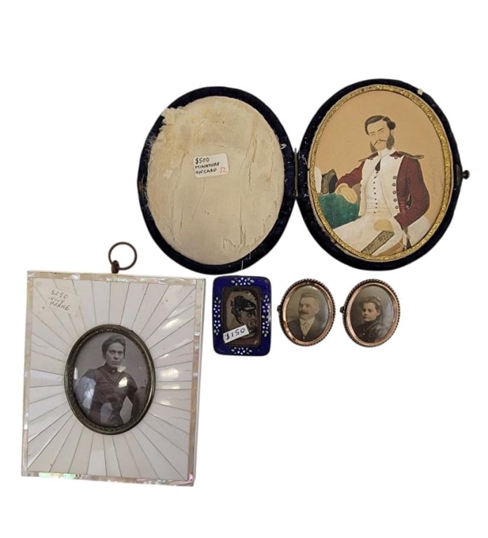 FIVE ANTIQUE MINIATURE PHOTOGRAPHS & A PAINTING: Five antique miniature photographs and a portrait painting on cardstock. Includes (4) framed photographs - one in a carved bone frame, two mounted as brooches, and one in a small cobalt enamel frame