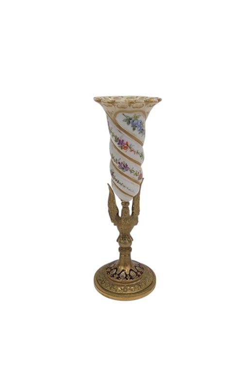 ANTIQUE BOHEMIAN BRONZE MOUNTED PORCELAIN BUD VASE: Antique Bohemian enameled gilt bronze mounted porcelain bud vase measuring 5.7" tall x 2" base diameter. Bronze stem is modeled in the form of a bird with its wing outstretched upward, red enamel deta