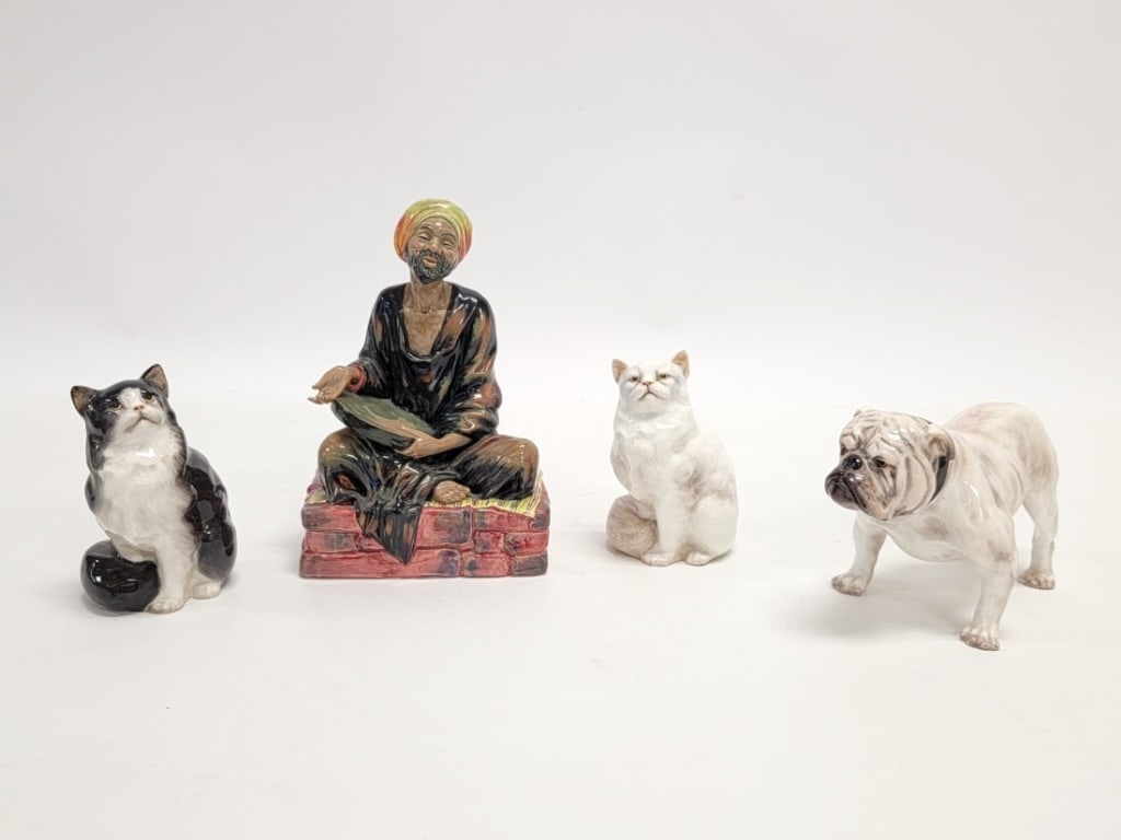 ROYAL DOULTON PORCELAIN: BULLDOG, CATS, MENDICANT: Four piece Royal Doulton porcelain lot. Includes 4.5" tall English bulldog #1073, 5" sitting white cat #2539, 5" tall sitting black and white cat #999, and 8" tall figure of "Mendicant" #1365.