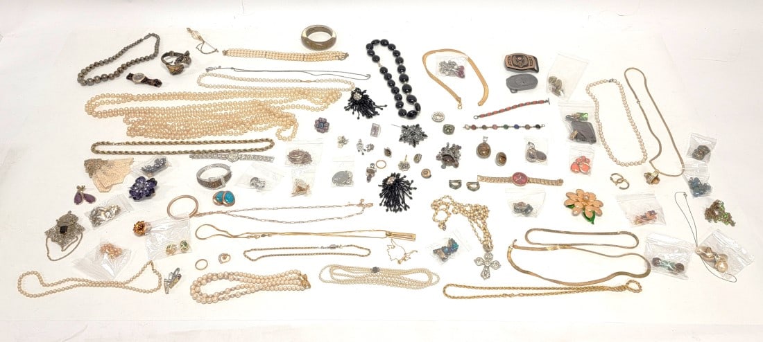 TRAY LOT LADIES COSTUME JEWELRY STERLING SILVER ETC: Tray lot assorted ladies costume jewelry. Includes a wide variety of items: necklaces, bracelets, earrings, brooches, belt buckles, etc. Includes semi precious stones, sterling silver, wood, enamels,
