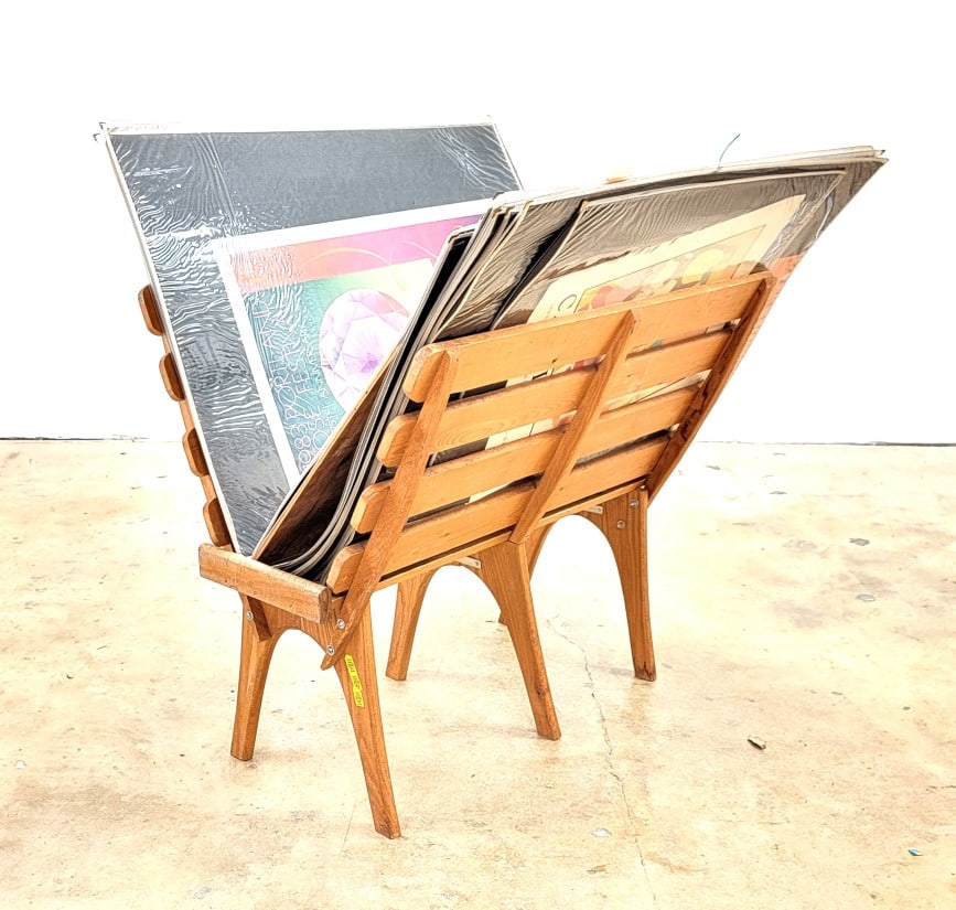 COLLECTION 60+ VINTAGE POSTERS, ART, TRAVEL, MUSIC: Huge collection of approximately 61 vintage posters ranging from Music to travel to modern art exhibitions. Includes wooden poster stand and poster sleeves. Includes several sleeves of vintage prints