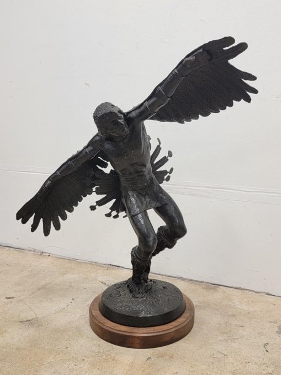 KARL QUILTER BRONZE SCULPTURE "EAGLE DANCER": Karl Quilter (American, b. 1929) bronze sculpture, titled "Eagle Dancer". Subject: Native American wearing traditional ritual dress. Mounted to circular wooden base. Signed, dated and numbered on the