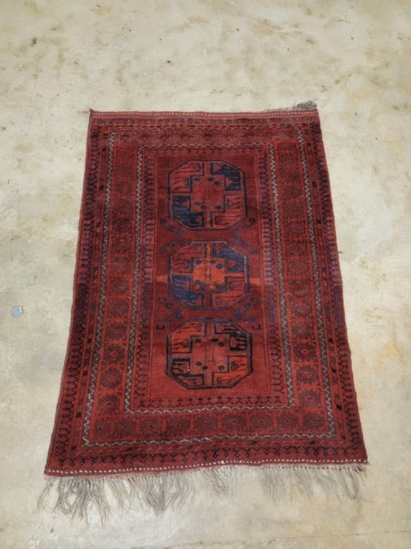 VINTAGE AFGHAN HAND-KNOTTED WOOL RUG 3'5" x 4'10": Vintage Afghan hand-knotted wool rug measuring 3'5" x 4'10". Bokhara pattern in deep reds. Condition: some abrash, minor losses to fringes, normal signs of use, see images. Weight: 10 lbs.