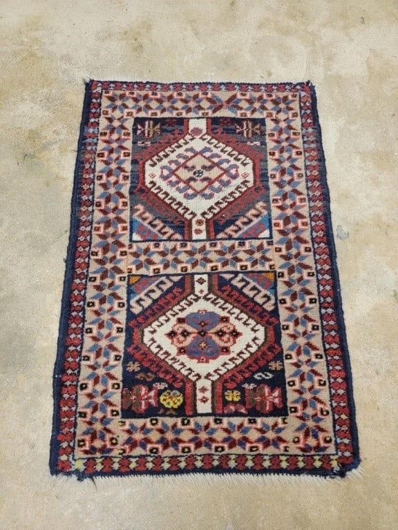 SMALL PERSIAN HAND KNOTTED WOOL RUG 1'9" X 2'8": Small Persian hand knotted wool rug measuring 1'9" x 2'8". Condition: heavy signs of wear, wear to fringes, wear to pile, selvedges re-wrapped, some unraveling at corners, see images. Weight: 3 lbs.