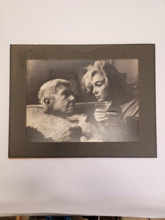 VNTG MARILYN MONROE & CARL SANDBURG PHOTOGRAPH: Vintage Marilyn Monroe & Carl Sandburg silver gelatin print photograph. Laid down to backing and measures a total of 14.7" tall x 18.4" wide. Condition: scattered minor signs of age, edges trimmed a