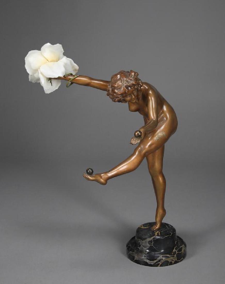 A BRONZE FIGURE AFTER CJR COLINET: "The Juggler," mounted on marble socle. NOTE: A gift to Anna Nicole Smith from her husband J. Howard Marshall. Height, 20 inches
