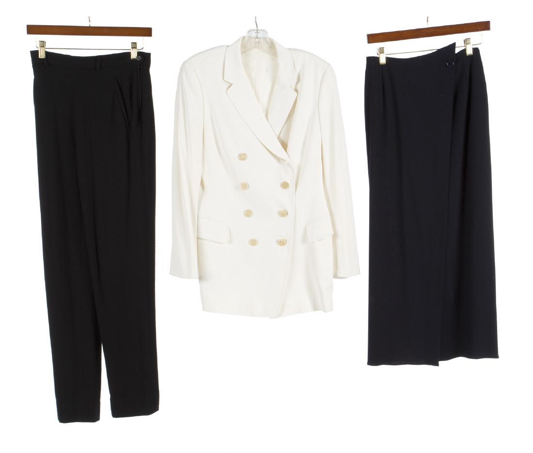 BARBRA STREISAND GARMENTS: A group of three garments from the wardrobe of Barbra Streisand: a white Jil Sander double-breasted jacket, size 36; a navy blue wool crepe skirt labeled "DKNY," size 6; and a pair of black cashmere t