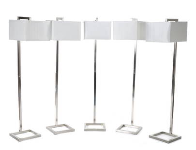 GROUP OF EIGHT LAMPS: Six modern brushed chrome floor lamps, together with two matching table lamps. Floor lamps, height 64 inches; Table lamps, height 30 inches Categories: Tommy Hilfiger