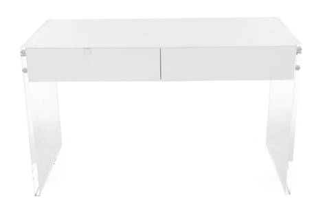 ACRYLIC TABLE AND CHAIRS: A vintage white table with acrylic sides, together with five vintage acrylic chairs. Table, 30 by 50 by 24; Chairs, 32 by 16 by 16 inches Categories: Tommy Hilfiger