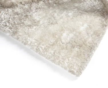 WHITE ON WHITE SHAG AREA RUG: With long pile fibers in two different yarns. 141 by 102 inches Categories: Tommy Hilfiger