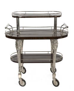 ROSEWOOD THREE TIER BAR CART: In a 19th century style, with chrome hardware and four wheels. 47 by 42 by 23 inches Categories: Tommy Hilfiger