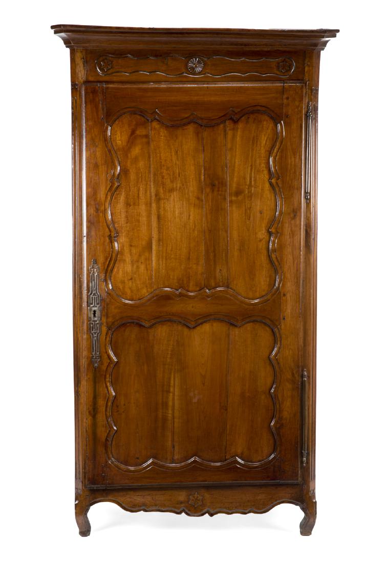 CARVED ARMOIRE: With antique and later parts, and star carved pattern on the crest. 82 by 46 by 28 inches Categories: Tommy Hilfiger