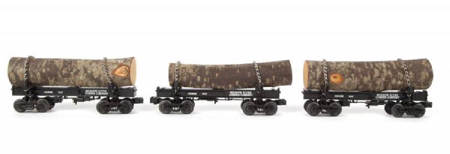 LIONEL MEADOW RIVER DIE-CAST LOG CAR 3-PACK: Cars have been run. Includes 18804, 18805, and 18806 log cars. No boxes. One car has a loose chain. Excellent. PROVENANCE From the Collection of Neil Young