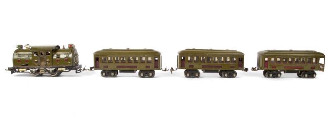 LIONEL PREWAR 254, 610, 610, 612 PASSENGER SET: Set has been run. The 254 electric locomotive has an olive body with a red stripe. The wheels have been replaced. The 610 coaches have olive bodies, with maroon plates and window trim. The 612 observa