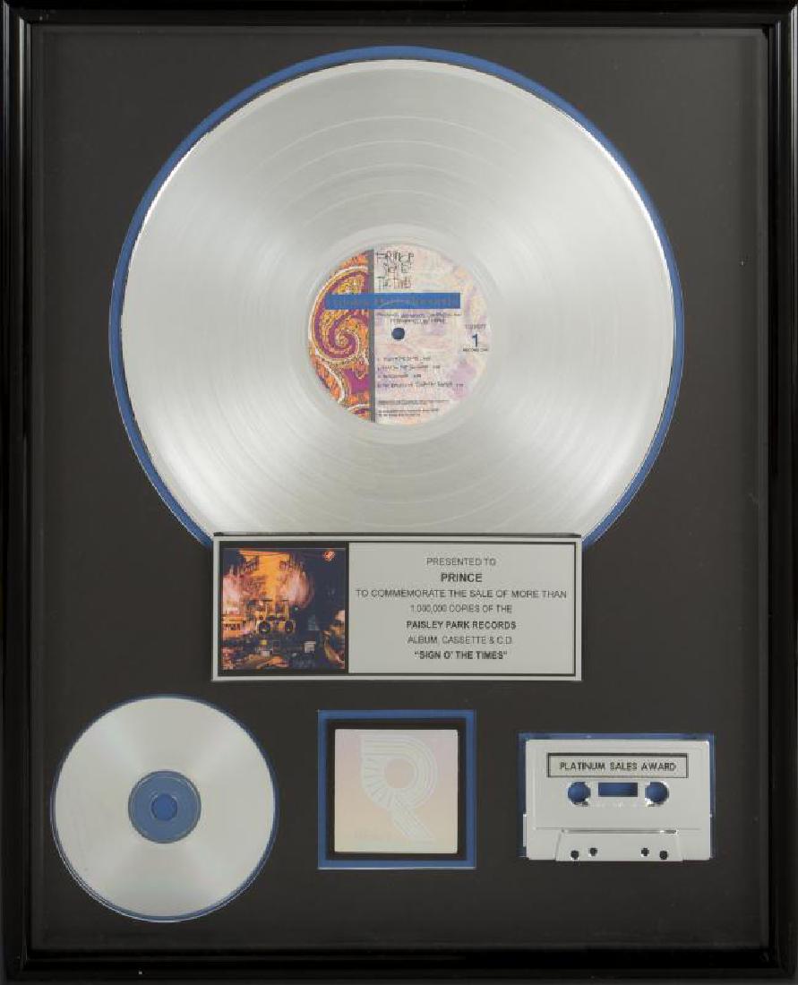 PRINCE "PLATINUM" RECORD AWARD +: Request condition report! An RIAA-certified "platinum" record award presented to Prince to commemorate the sale of more than one million copies of the Paisley Park Records album, cassette and CD Sign