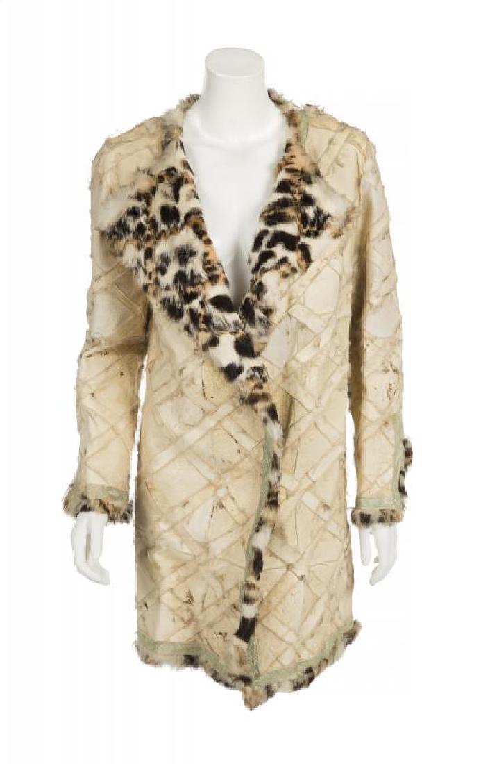 CHER GIANNI VERSACE FUR COAT •: Request condition report! A cheetah-patterned lined coat with snakeskin edging, made with rabbit fur. Label reads "Gianni Versace 40." PROVENANCE From the Collection of Cher Cher
