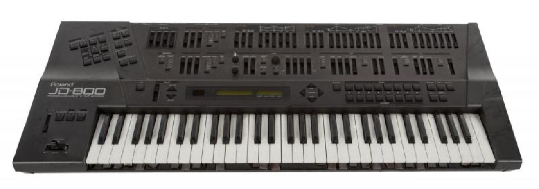 KEITH EMERSON ROLAND JD800 PROGRAMMABLE SYNTH: Request condition report! Serial number ZC30335. Within a road case. 7 1/2 by 32 by 19 1/2 inches; Road Case, 12 1/2 by 26 by 38 inches PROVENANCE From the Estate of Keith Emerson Keith Emerson