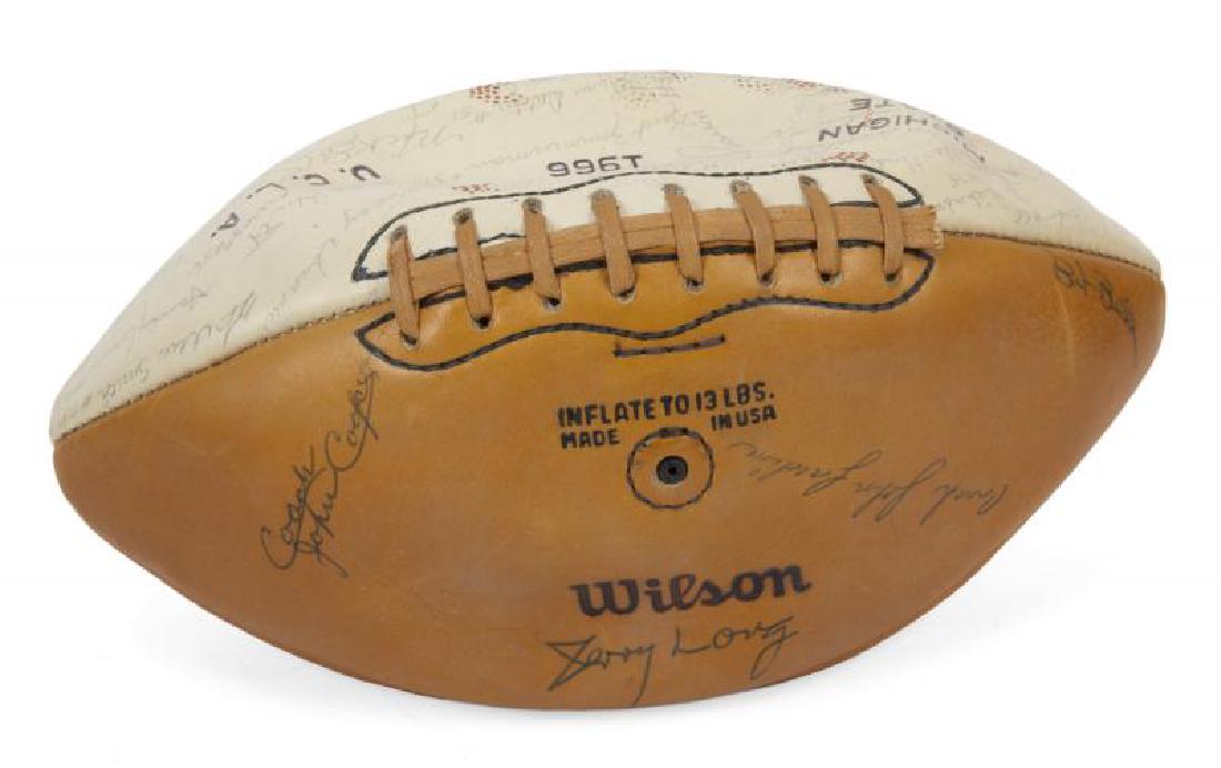 JERRY LEWIS 1966 ROSE BOWL UCLA PLAYERS AND COACHES: A Wilson brand 1966 football stamped "Michigan State," "Rose Bowl 1966," and "U.C.L.A." and featuring the signatures of players and coaches of the victorious UCLA team. Signatures include Gary Beban,