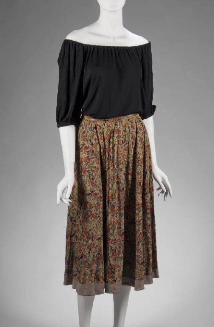 JANE RUSSELL THE OUTLAW COSTUME WITH DVD: A two-piece ensemble worn by Jane Russell as Rio McDonald in The Outlaw (United Artists, 1943). Consisting of a black silk jersey peasant top with elastic at the neckline and sleeves and a rayon multi