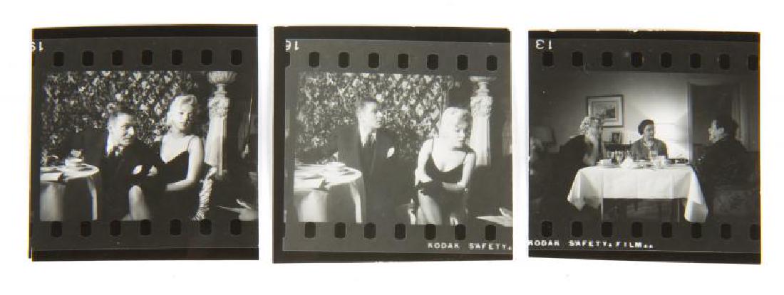 MARILYN MONROE THE PRINCE AND THE SHOWGIRL IMAGES: Three black and white images of Marilyn Monroe, some with co-star Laurence Olivier, on the set of The Prince and the Showgirl (Warner Bros., 1957). The images appear to have been cut from a larger con