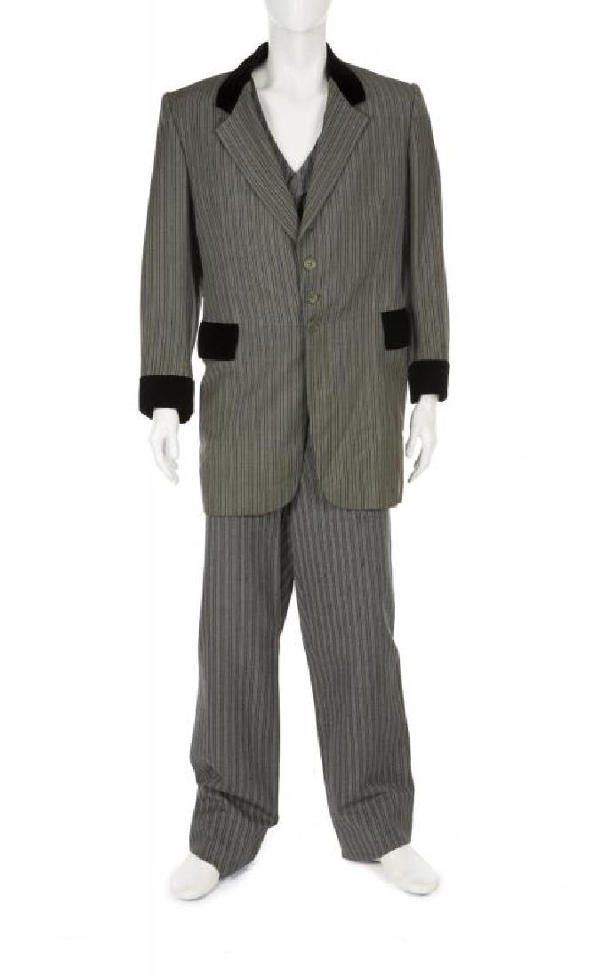 ERNIE KOVACS CUSTOM-MADE SUIT: A vintage grey pinstriped three-piece suit in the style of the 1890s with velvet collar, pockets, and cuffs. The jacket has a Western Costume Company label that reads ""2515-1 Ernie Kovac [sic] #3.""