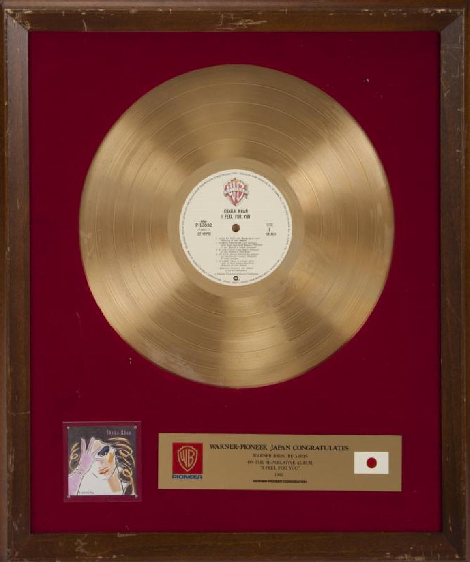 MADONNA JAPANESE RECORD AWARD: A Warner-Pioneer Japan record award presented to Warner Bros. Records for the 1985 superlative album I Feel For You. 19 1/2 by 17 inches Madonna